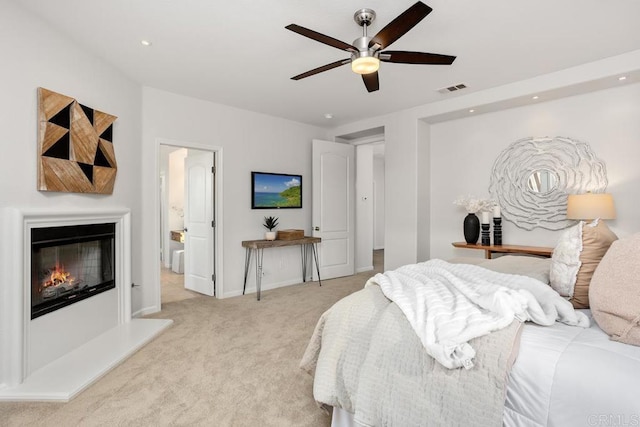 2386 Lapis Rd, Carlsbad, CA 92009 - bedroom featuring light carpet, a glass covered fireplace, recessed lighting, baseboards, and ceiling fan