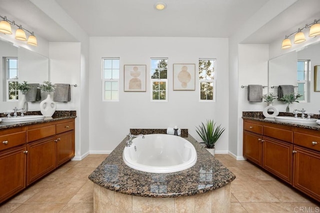 2386 Lapis Rd, Carlsbad, CA 92009 - full bath with a garden tub, two vanities, baseboards, and tile patterned flooring