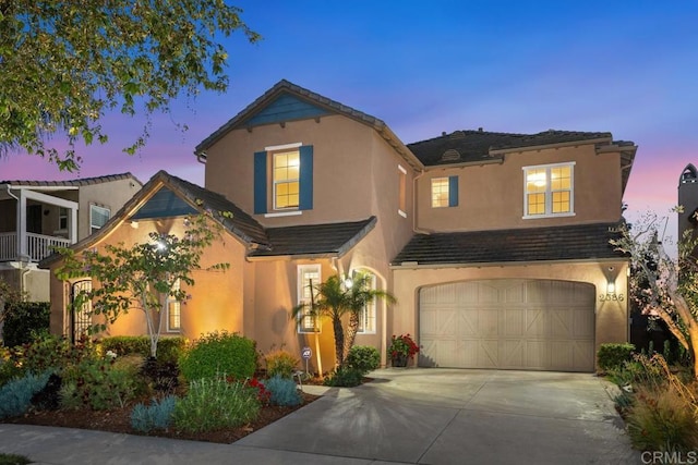 2386 Lapis Rd, Carlsbad, CA 92009 - view of front of property with a garage, concrete driveway, stucco siding, and a tiled roof