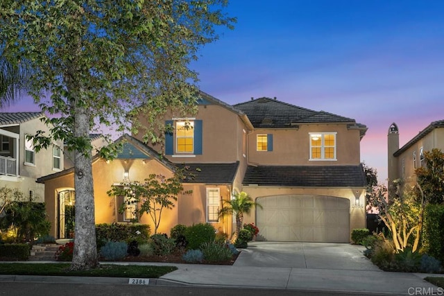 2386 Lapis Rd, Carlsbad, CA 92009 - view of front of home featuring driveway, a garage, and stucco siding