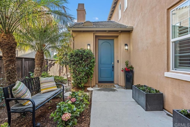 2386 Lapis Rd, Carlsbad, CA 92009 - property entrance featuring stucco siding and a chimney