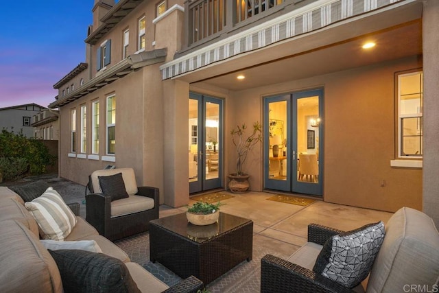 2386 Lapis Rd, Carlsbad, CA 92009 - patio terrace at dusk featuring a balcony, french doors, an outdoor hangout area, and a patio area