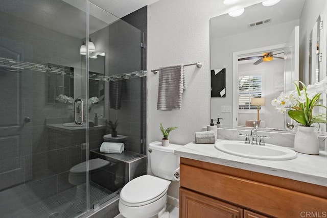 2386 Lapis Rd, Carlsbad, CA 92009 - full bathroom with toilet, vanity, a stall shower, and a ceiling fan