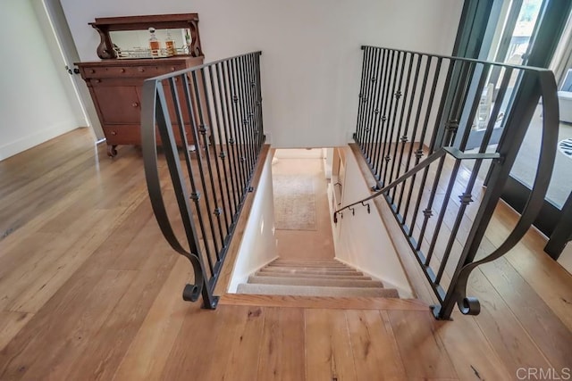 10509 Challenge Blvd, La Mesa, CA 91941 - stairway featuring wood finished floors, healthy amount of natural light, and baseboards