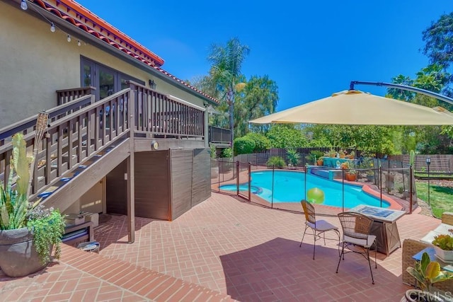 10509 Challenge Blvd, La Mesa, CA 91941 - view of swimming pool featuring a pool with connected hot tub, a fenced backyard, a wooden deck, and a patio