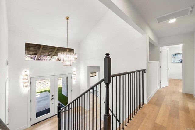 1711 Alhudson Dr, Escondido, CA 92029 - hall featuring an upstairs landing, light wood-type flooring, a chandelier, french doors, and recessed lighting