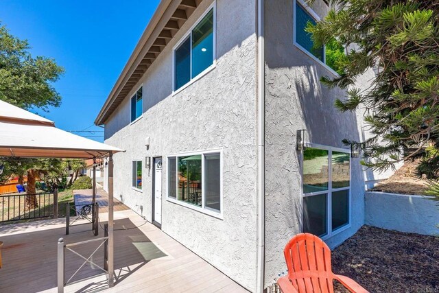 1711 Alhudson Dr, Escondido, CA 92029 - rear view of house featuring a gazebo, stucco siding, and a wooden deck