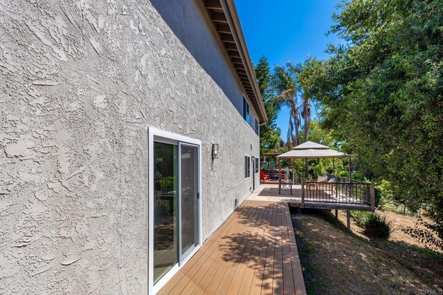 1711 Alhudson Dr, Escondido, CA 92029 - view of home's exterior with stucco siding and a wooden deck