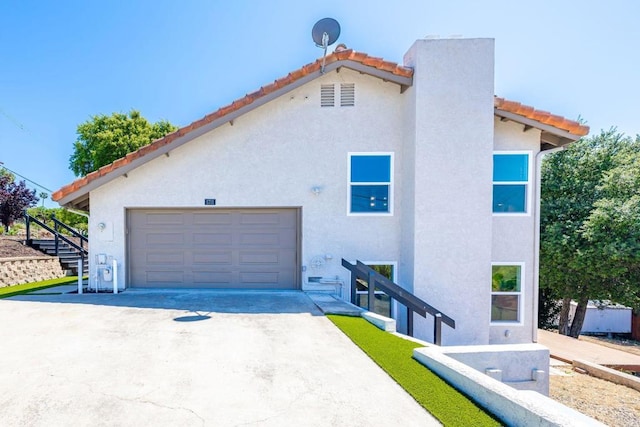 1711 Alhudson Dr, Escondido, CA 92029 - view of property exterior with a tile roof, driveway, a garage, and stucco siding