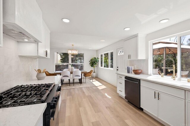 1711 Alhudson Dr, Escondido, CA 92029 - kitchen featuring dishwashing machine, black range with gas stovetop, custom exhaust hood, light wood finished floors, and a sink