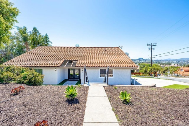 1711 Alhudson Dr, Escondido, CA 92029 - mediterranean / spanish home featuring a tile roof, french doors, and stucco siding