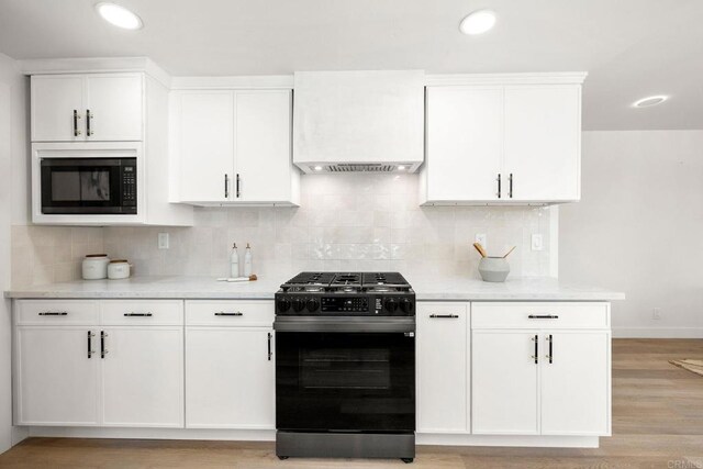 1711 Alhudson Dr, Escondido, CA 92029 - kitchen with black range with gas stovetop, built in microwave, white cabinets, backsplash, and recessed lighting
