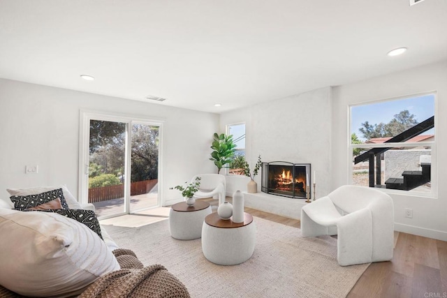 1711 Alhudson Dr, Escondido, CA 92029 - living area with wood finished floors, a large fireplace, recessed lighting, and baseboards