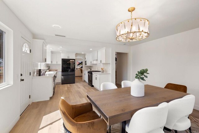 1711 Alhudson Dr, Escondido, CA 92029 - dining space with light wood-style flooring, a chandelier, and recessed lighting