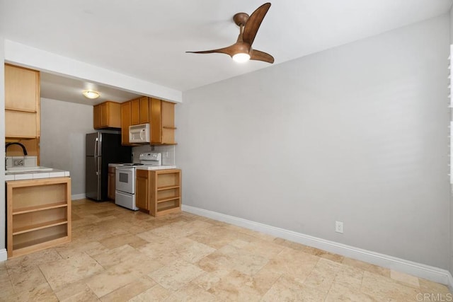 356 S Miraleste Dr Unit 327, San Pedro, CA 90732 - kitchen with white appliances, open shelves, tile countertops, and a sink
