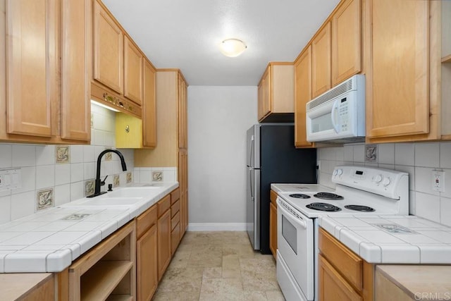 356 S Miraleste Dr Unit 327, San Pedro, CA 90732 - kitchen with white appliances, baseboards, tile counters, and decorative backsplash