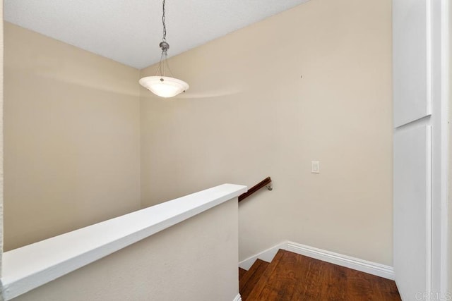 356 S Miraleste Dr Unit 327, San Pedro, CA 90732 - hallway featuring baseboards, wood finished floors, and an upstairs landing