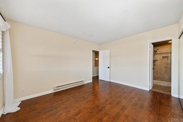 356 S Miraleste Dr Unit 327, San Pedro, CA 90732 - unfurnished bedroom featuring baseboard heating, wood finished floors, baseboards, and a textured ceiling