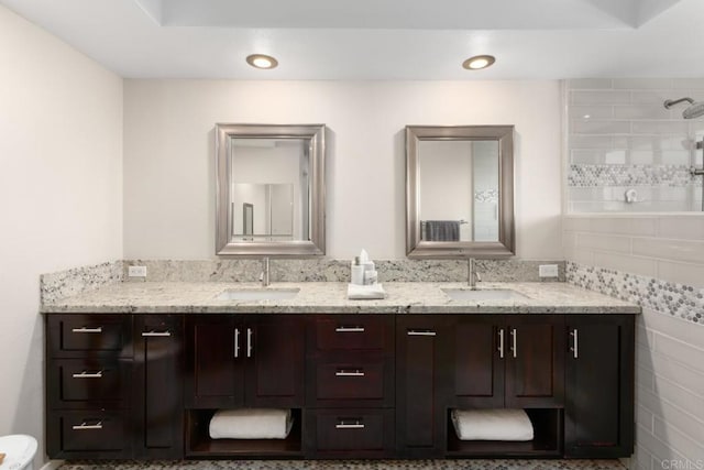11171 Alejo Pl, San Diego, CA 92124 - bathroom featuring double vanity, recessed lighting, and a tile shower