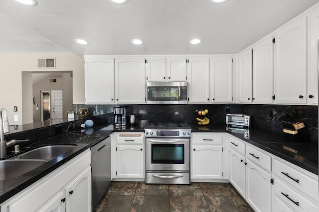 11171 Alejo Pl, San Diego, CA 92124 - kitchen featuring appliances with stainless steel finishes, white cabinets, a sink, tasteful backsplash, and recessed lighting