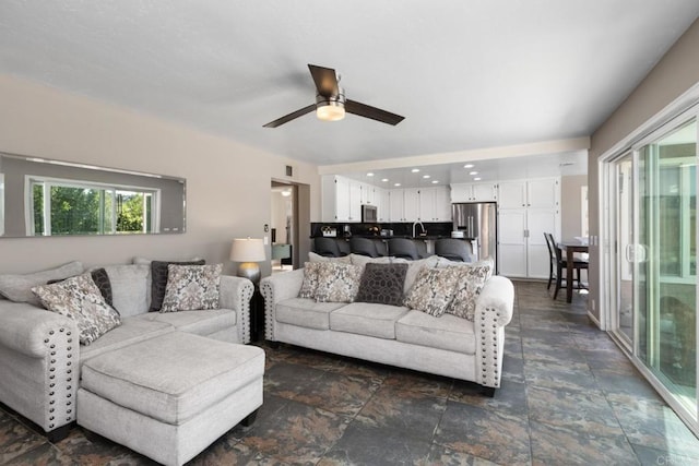 11171 Alejo Pl, San Diego, CA 92124 - living area featuring dark stone finish floors and ceiling fan