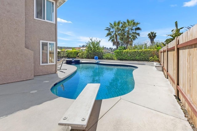 11171 Alejo Pl, San Diego, CA 92124 - view of swimming pool with a fenced backyard, a patio area, a diving board, and a pool with connected hot tub