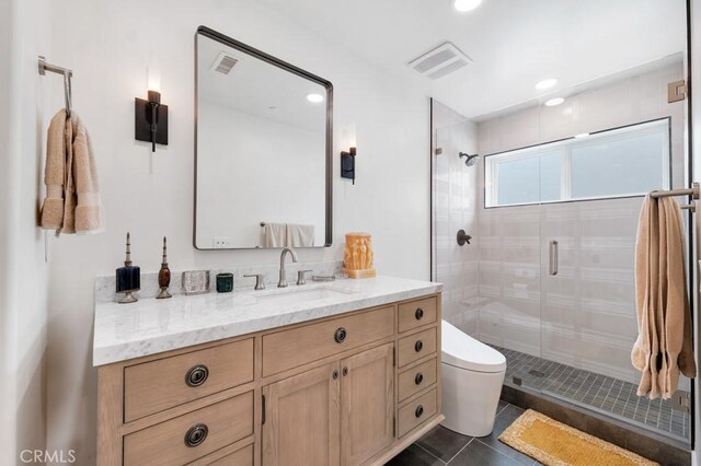 8 Saint Tropez, Laguna Niguel, CA 92677 - bathroom with toilet, vanity, a shower stall, tile patterned flooring, and recessed lighting