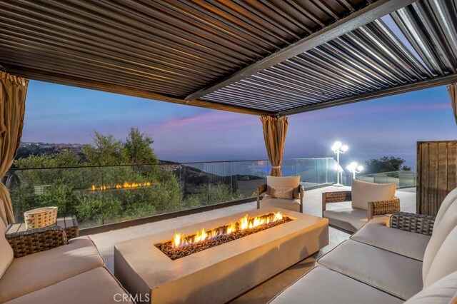 8 Saint Tropez, Laguna Niguel, CA 92677 - patio terrace at dusk with an outdoor living space with a fire pit and a patio area