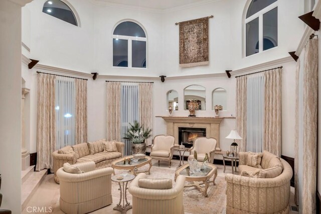 8 Saint Tropez, Laguna Niguel, CA 92677 - living area with a high ceiling, a glass covered fireplace, and ornamental molding