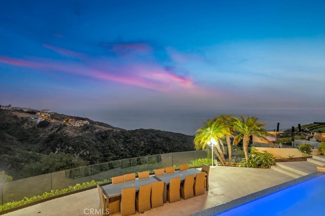 8 Saint Tropez, Laguna Niguel, CA 92677 - pool at dusk featuring a patio area
