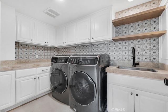 8 Saint Tropez, Laguna Niguel, CA 92677 - washroom with independent washer and dryer, cabinet space, and light tile patterned flooring