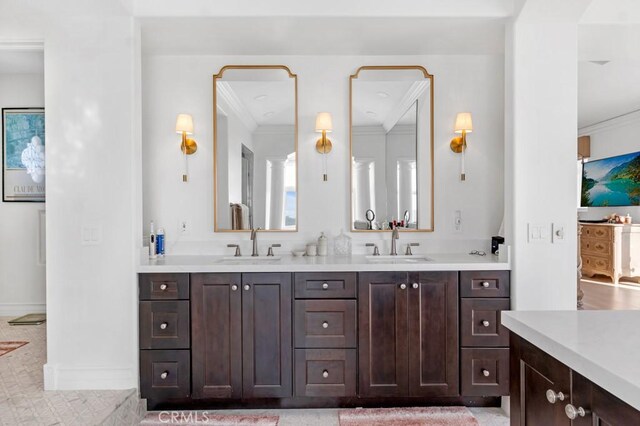 8 Saint Tropez, Laguna Niguel, CA 92677 - full bathroom with crown molding, double vanity, and baseboards