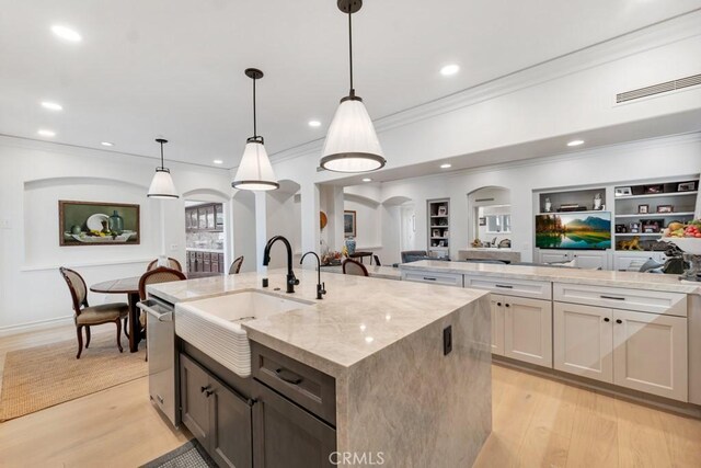 8 Saint Tropez, Laguna Niguel, CA 92677 - kitchen with a sink, open floor plan, crown molding, an island with sink, and stainless steel dishwasher