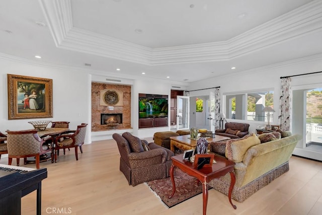 8 Saint Tropez, Laguna Niguel, CA 92677 - living area with light wood-style floors, a tray ceiling, crown molding, a high end fireplace, and recessed lighting