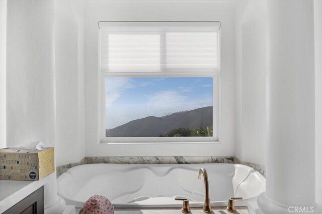 8 Saint Tropez, Laguna Niguel, CA 92677 - bathroom featuring a tub to relax in, healthy amount of natural light, and vanity
