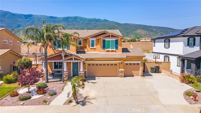 15190 Fox Ridge Dr, Fontana, CA 92336 - view of front of house featuring driveway, a mountain view, stucco siding, an attached garage, and a tiled roof