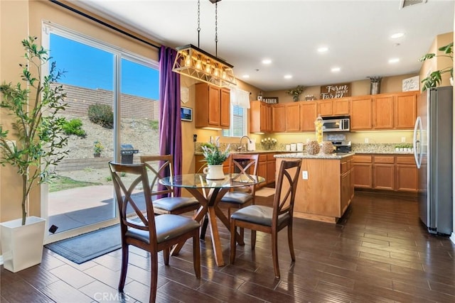 15190 Fox Ridge Dr, Fontana, CA 92336 - dining room featuring dark wood-style flooring and recessed lighting