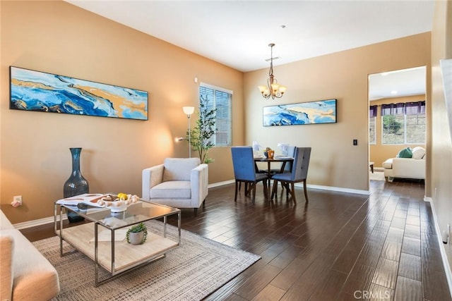 15190 Fox Ridge Dr, Fontana, CA 92336 - living area with a chandelier, wood finished floors, and baseboards