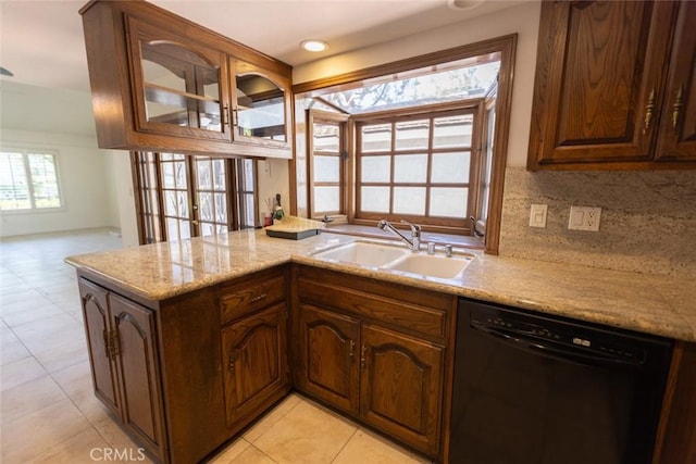 1903 W W Wind, Santa Ana, CA 92704 - kitchen with dishwasher, a sink, backsplash, glass insert cabinets, and light stone countertops