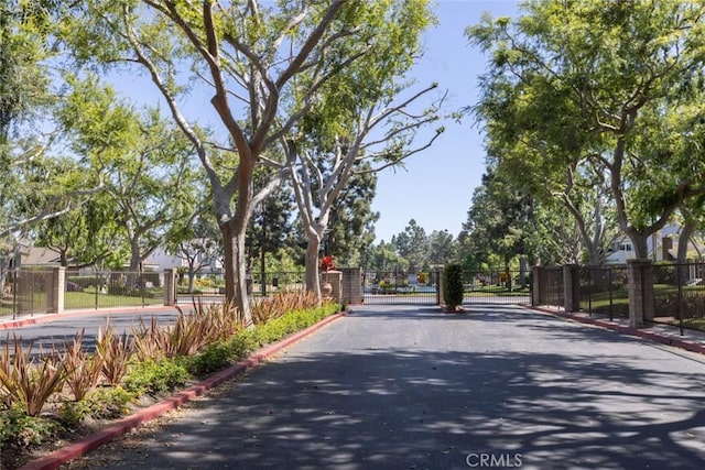 1903 W W Wind, Santa Ana, CA 92704 - view of asphalt road with curbs, a gate, and a gated entry