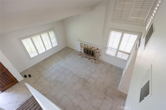 1903 W W Wind, Santa Ana, CA 92704 - unfurnished living room with healthy amount of natural light and a glass covered fireplace