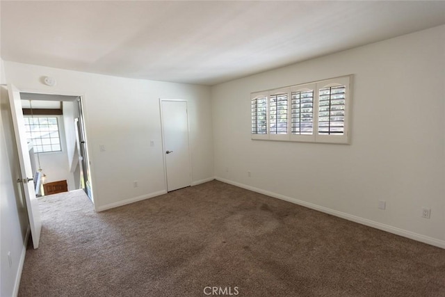 1903 W W Wind, Santa Ana, CA 92704 - unfurnished bedroom featuring carpet floors, multiple windows, and baseboards