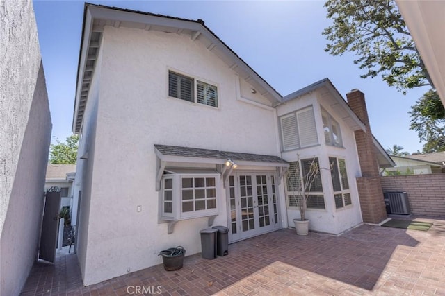 1903 W W Wind, Santa Ana, CA 92704 - back of house with french doors, stucco siding, a patio area, and a chimney