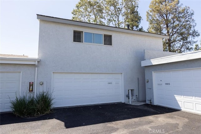 1903 W W Wind, Santa Ana, CA 92704 - view of front of property featuring stucco siding and a garage