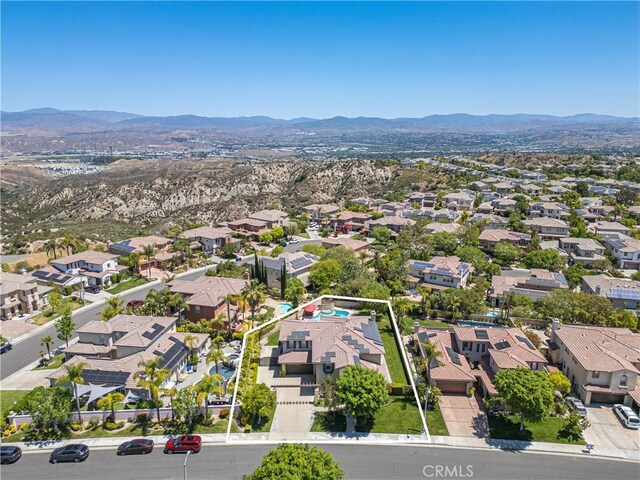 26865 Grey Pl, Stevenson Ranch, CA 91381 - aerial view of residential area with mountains and property parcel outlined