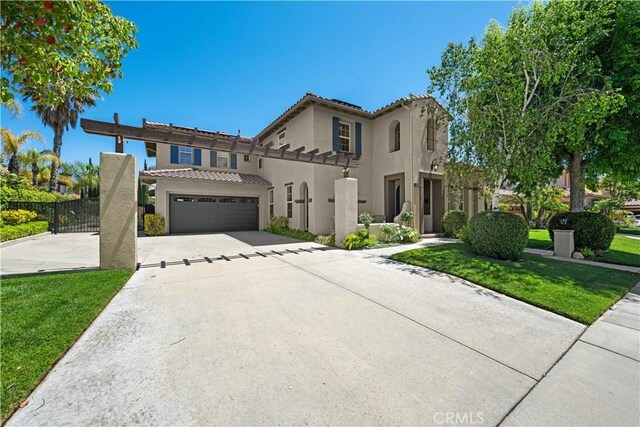 26865 Grey Pl, Stevenson Ranch, CA 91381 - mediterranean / spanish-style house featuring driveway, stucco siding, and a tile roof