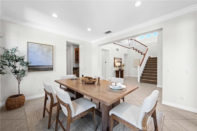 26865 Grey Pl, Stevenson Ranch, CA 91381 - dining area featuring light tile patterned floors, stairway, crown molding, recessed lighting, and baseboards