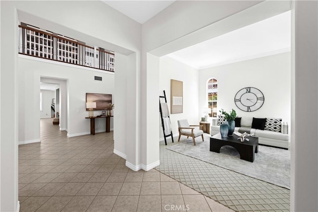 26865 Grey Pl, Stevenson Ranch, CA 91381 - tiled living area featuring baseboards and arched walkways