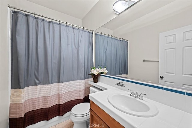 26865 Grey Pl, Stevenson Ranch, CA 91381 - bathroom featuring toilet, vanity, a shower with shower curtain, and decorative backsplash