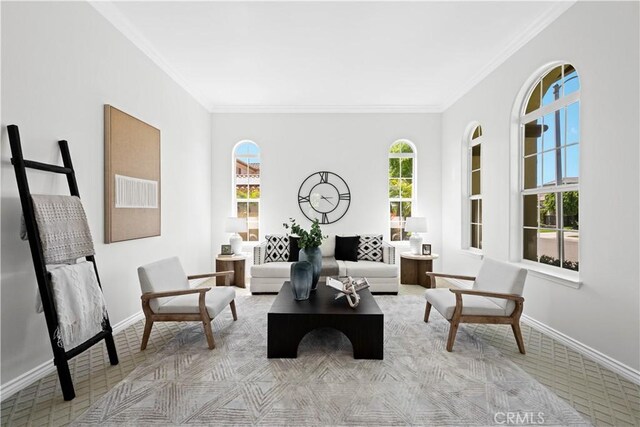 26865 Grey Pl, Stevenson Ranch, CA 91381 - living area featuring light colored carpet, ornamental molding, and baseboards